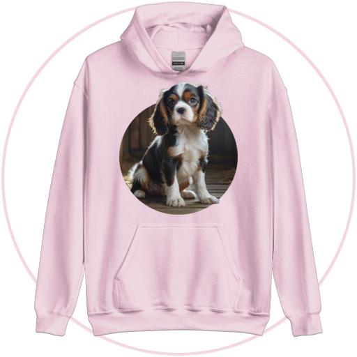 Cavalier pup sits in the barn